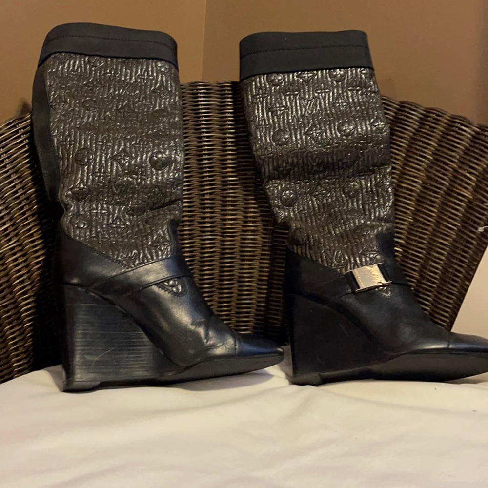 Previously owned Louis Vuitton Motard Knee High Boots.